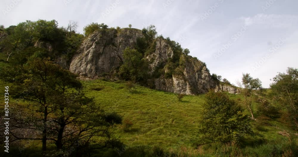 Wide shot looking back up the dovetail walk of a rocky outcrop of rocks, crag, rockface. Wide shot looking back up the dovetail walk of a rocky outcrop of rocks, crag, rockface.