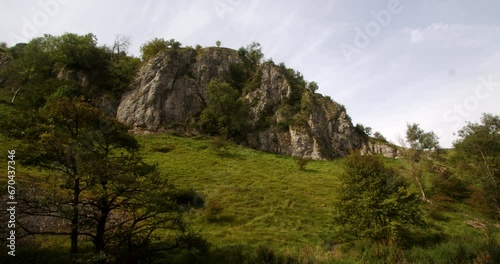 Wide shot looking back up the dovetail walk of a rocky outcrop of rocks, crag, rockface. photo