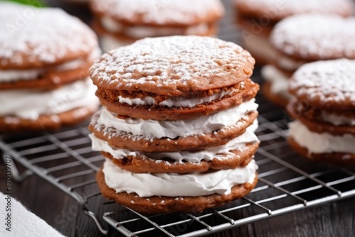 stacking cookie sandwiches filled with cream