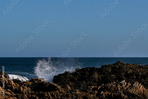 Waves crashing onto rocks