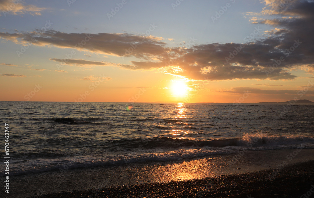 Beautiful amber-colored sunset on the sea. Evening sea background.