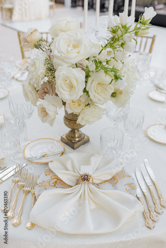 Vertical image of fragment of guest place of wedding table silverware,napkin with vintage ring .  © Татьяна Волкова