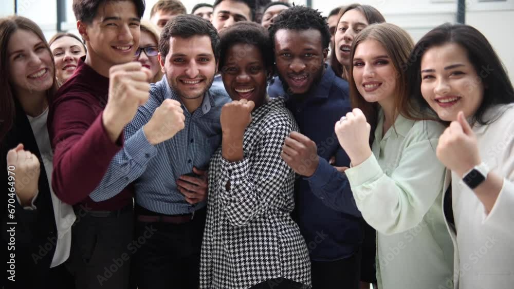 Confident diverse college students show fist up. Confident diverse college students show fist up.