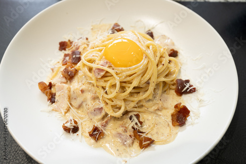 Carbonara pasta, spaghetti with pancetta , bacon, egg, parmesan cheese and cream sauce. Traditional italian cuisine.