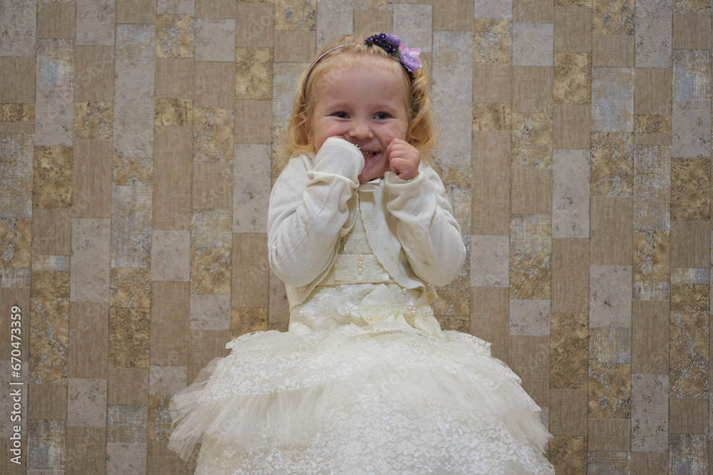 shy little girl in a white dress,portrait of a beautiful smiling girl ...
