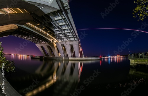 Captivating night view of the illuminated Woodrow Wilson Memorial Bridge crossing the Potomac River
