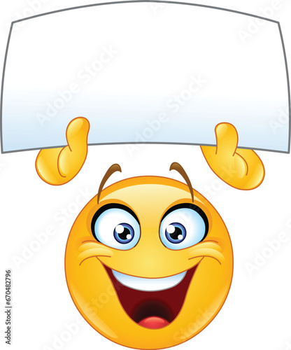 Happy emoji emoticon holding up a blank sign