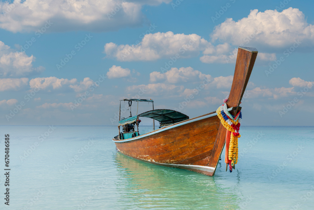 Thai traditional wooden longtail boat and beautiful sand Railay Beach in Krabi province, Thailand. Thai traditional wooden longtail boat and beautiful sand Railay Beach in Krabi province, Thailand.
