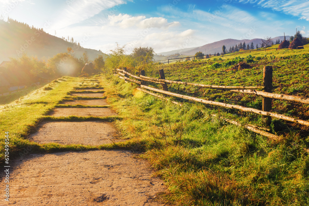 mountainous rural landscape with fence on the field. countryside scenery with rolling hills in autumn mountainous rural landscape with fence on the field. countryside scenery with rolling hills in autumn