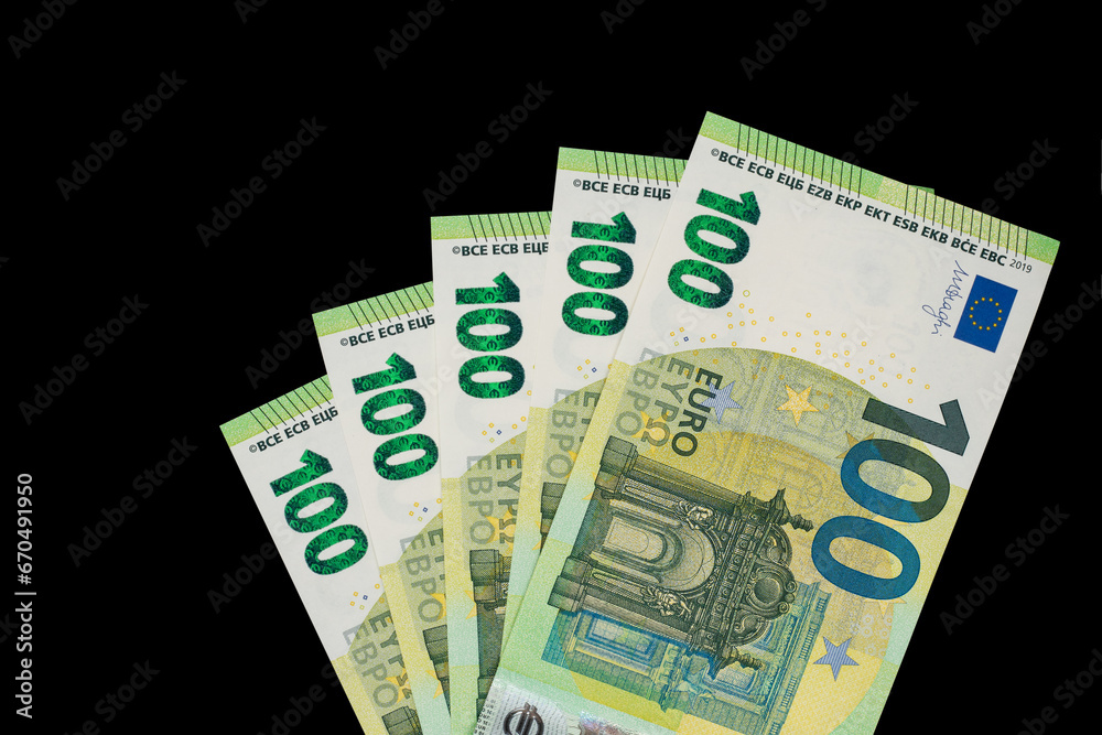 100 euro bills euro banknotes money on dark background. European Union Currency 100 euro bills euro banknotes money on dark background. European Union Currency