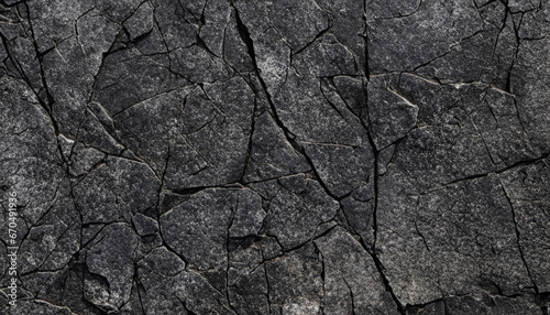 Black white rock texture. Dark gray stone granite background for design. Rough cracked mountain surface. Close-up