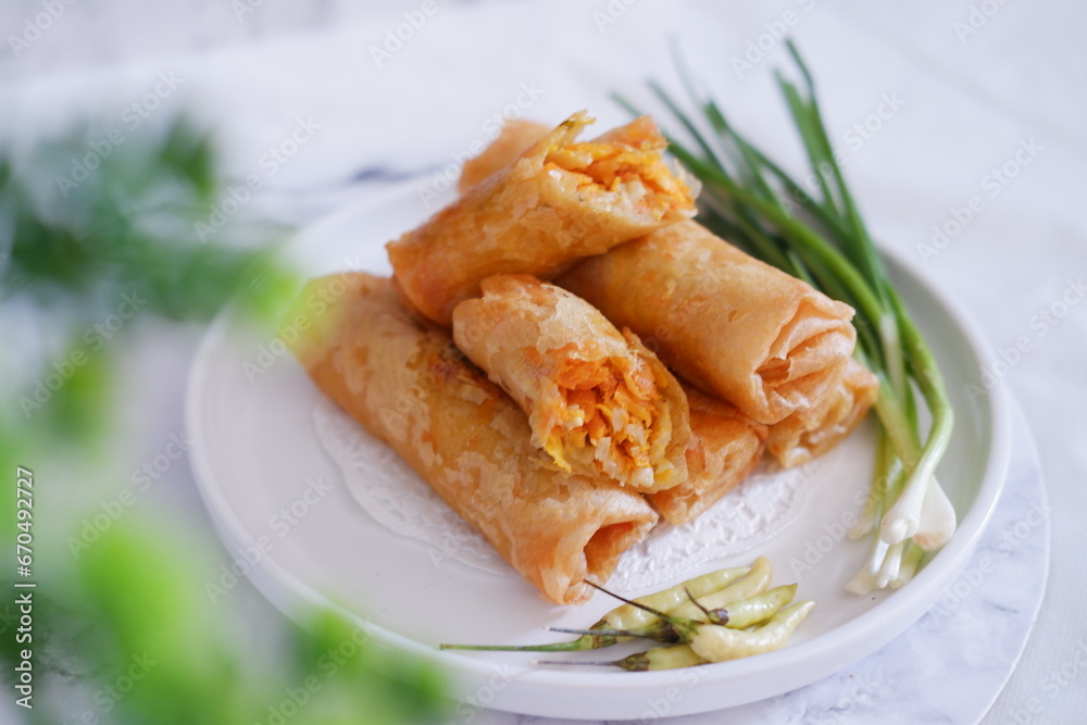 Lumpia or lunpia, traditional snacks from Semarang, Central Java, Indonesia. Traditional spring roll Lumpia or lunpia, traditional snacks from Semarang, Central Java, Indonesia. Traditional spring roll