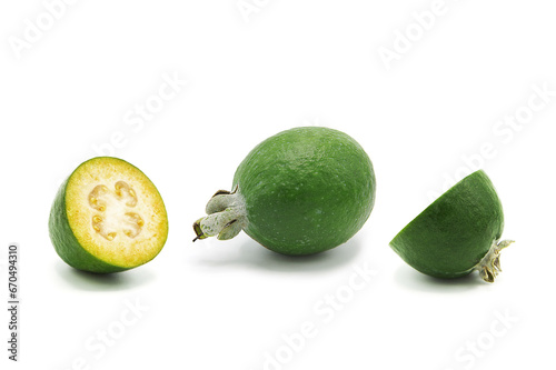 Fresh ripe feijoa whole and half isolated on white background.