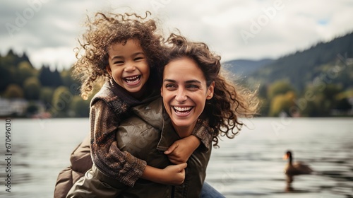 Child Crackpot Chick Riding on Parent's Back in Lake photo