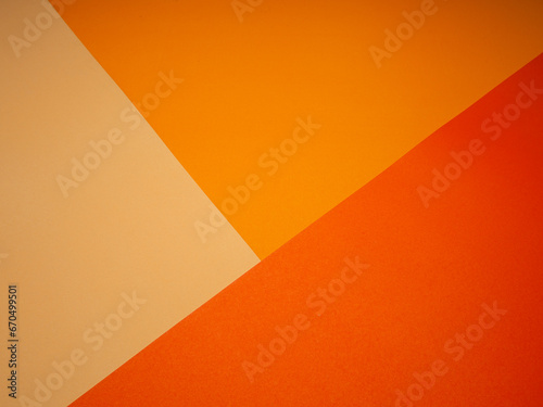 Top view for light orange, orange, and red paper color for the background.