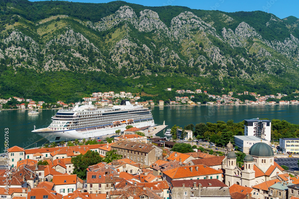 view of the old town of Kotor in Montenegro and the coast of the Bay of Kotor, the sea and medieval European architecture, red tiled roofs, the concept of traveling across the Balkans