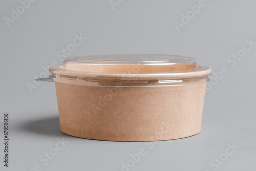 Disposable paper container with plastic lid. Rice bowl for takeaway. Recyclable material. Eco friendly food packaging. Delivery box meal.