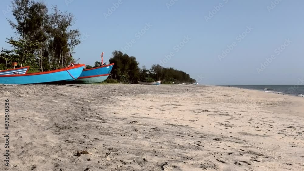 Colorful fishing boats parked on the beach Colorful fishing boats parked on the beach