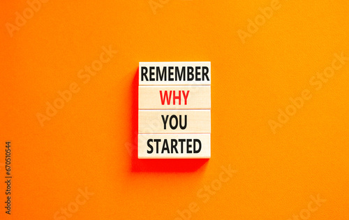 Remember why you started symbol. Concept word Remember why you started on beautiful wooden block. Beautiful orange table orange background. Business remember why you started concept. Copy space.