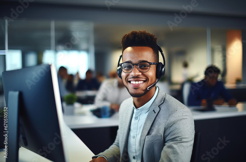 Smiling African American man in headset watch webinar or training on modern computer, happy biracial male call center agent or telemarketer work consult client online, good customer service concept