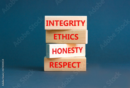 Integrity ethics honesty respect symbol. Concept word Integrity Ethics Honesty Respect on block. Beautiful grey background. Business integrity ethics honesty respect concept.