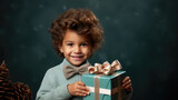 little cute boy holding gift box with ribbons on color background, child in knitted sweater, smiling happy kid, new year, christmas, eve, present, kindergarten, childhood, holiday, winter, toddler