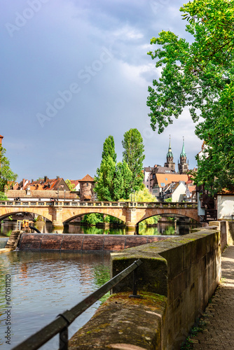 Colourful historic old town with half-timbered houses of Nuremberg. Bridges over Pegnitz river. Nurnberg, eastern Bavaria, Germany. Vertical photo