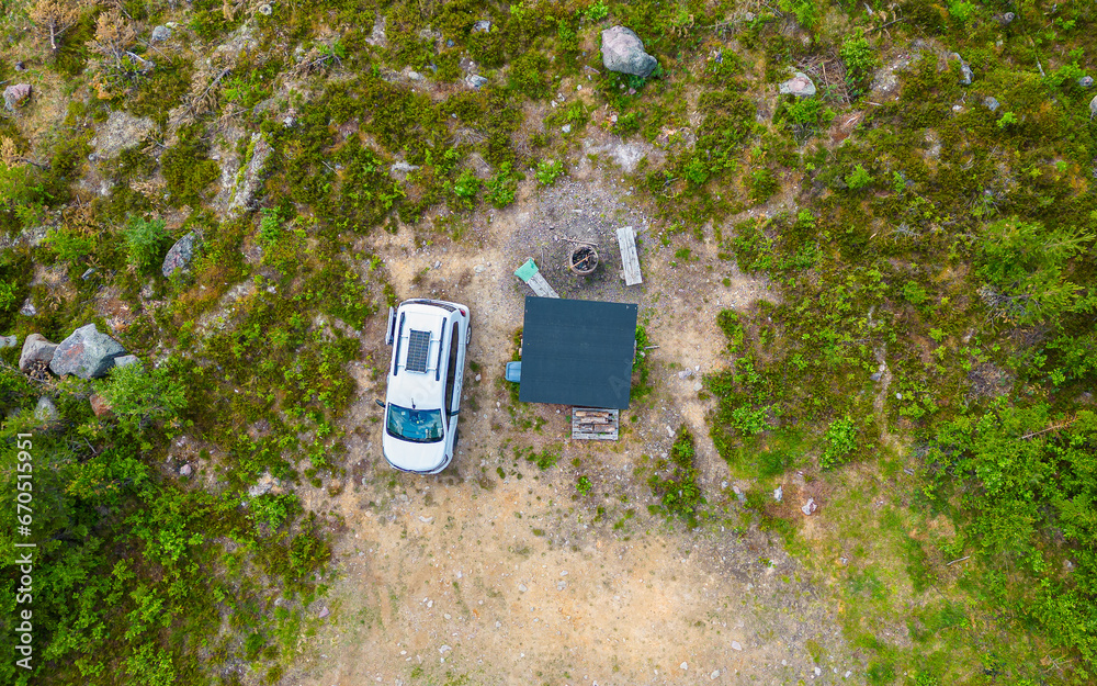 Camping spot with wooden shelter hut, Camping car parked in pure