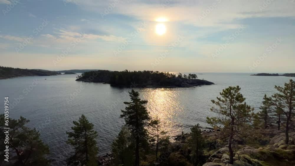 Russia, Karelia, Lake Ladoga, Koyonsaari. View of the coast of the island in a cold lake. Beautiful nature of the Republic of Karelia. Stunning panoramic view of the Ladoga Skerry Islands. 4K Russia, Karelia, Lake Ladoga, Koyonsaari. View of the coast of the island in a cold lake. Beautiful nature of the Republic of Karelia. Stunning panoramic view of the Ladoga Skerry Islands. 4K