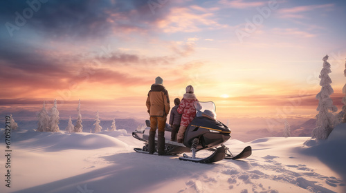 A family beside their snowmobile during a snowy sunset, enjoying the beautiful and tranquil scene