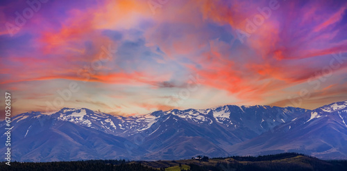 The sunset view mountain of alpine as snow-capped mount peaks in Winter mountains