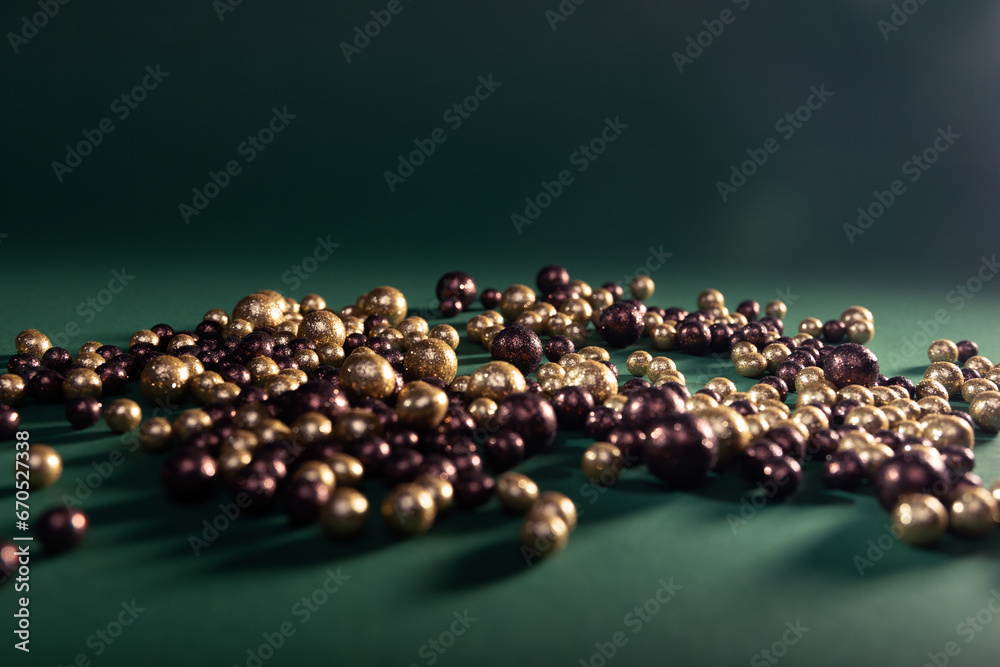 brown-gold balls on a green background brown-gold balls on a green background