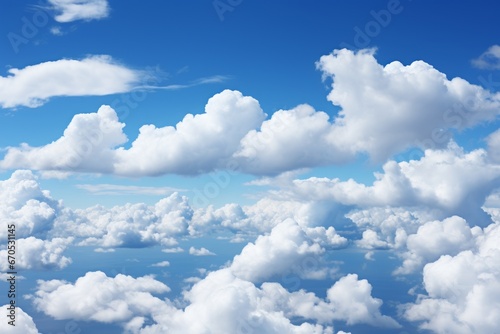 Captivating Landscape: Vast, Clear Blue Sky Filled with Scattered Fluffy White Clouds