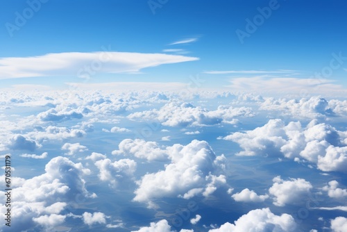 Serenity in the Sky: Vast Blue Expanse with Fluffy White Clouds, Evoking Tranquility and Grandeur photo