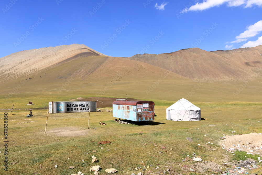 August 20 2023 - Kyrgyzstan, Central Asia: people milking mares to obtain milk for kumis at the Ala-Bel-Pass