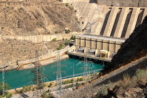 Kurpsai Hydro station. Lower Naryn River Canyon near Toktogul in Kyrgyzstan. Hydroelectric dam in central asia photo