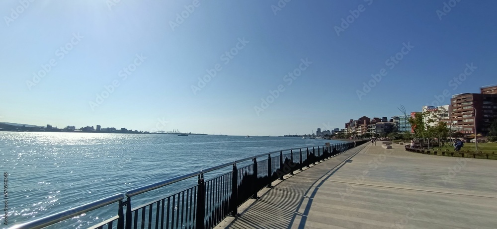 Picturesque view of an urban area featuring a waterfront on a sunny day