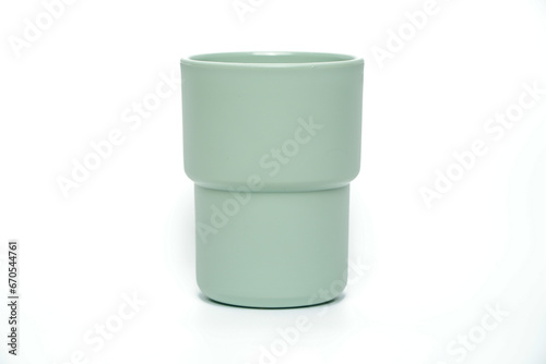 Plastic mug of different colors isolated on white, Clipping path included.