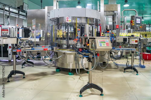 Cooking oil or Sunflower oil in the bottle moving on production line, factory in Ho Chi Minh city, Vietnam