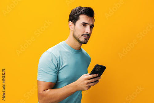Communication man space copy smiling portrait phone mobile cyberspace phone studio smartphone happy technology yellow