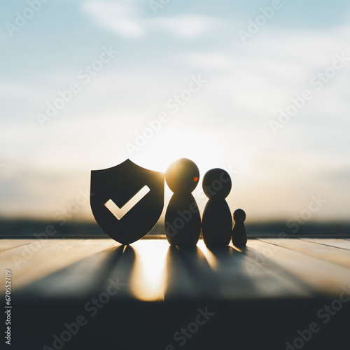 Shield protect icon and family model, Security protection and health insurance. The concept of family home, protection, health care day, car insurance.	 photo
