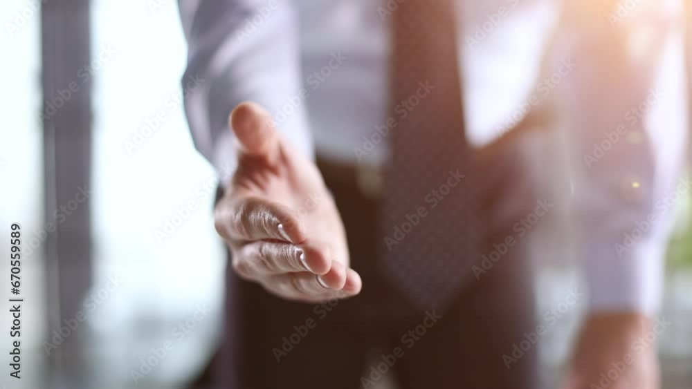 Close up agent reach out hand to camera handshake client. Close up agent reach out hand to camera handshake client.