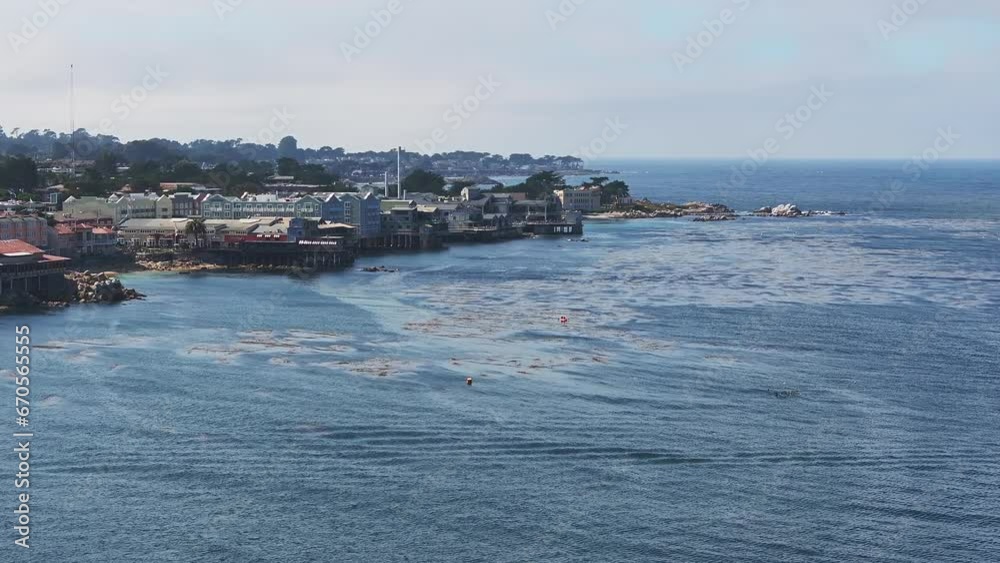 Aerial view of the Monterey Bay Aquarium, Pacific Grove with many yachts docked by the coastline in Monterey, central California. Landmarks around Monterey Bay, California. Aerial view of the Monterey Bay Aquarium, Pacific Grove with many yachts docked by the coastline in Monterey, central California. Landmarks around Monterey Bay, California.