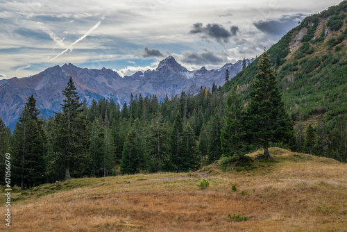 Alpine landscape with summits and clouds in autumn