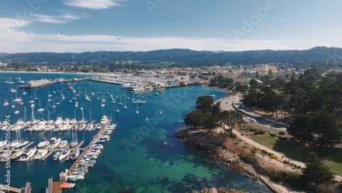 Aerial view of the Monterey Bay Aquarium, Pacific Grove with many yachts docked by the coastline in Monterey, central California. Landmarks around Monterey Bay, California.