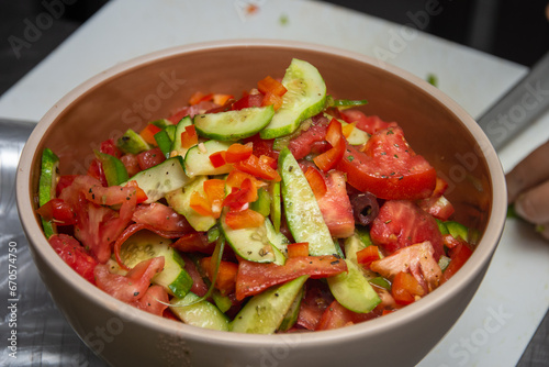 Cucumber salad with tomatoes, cheese,