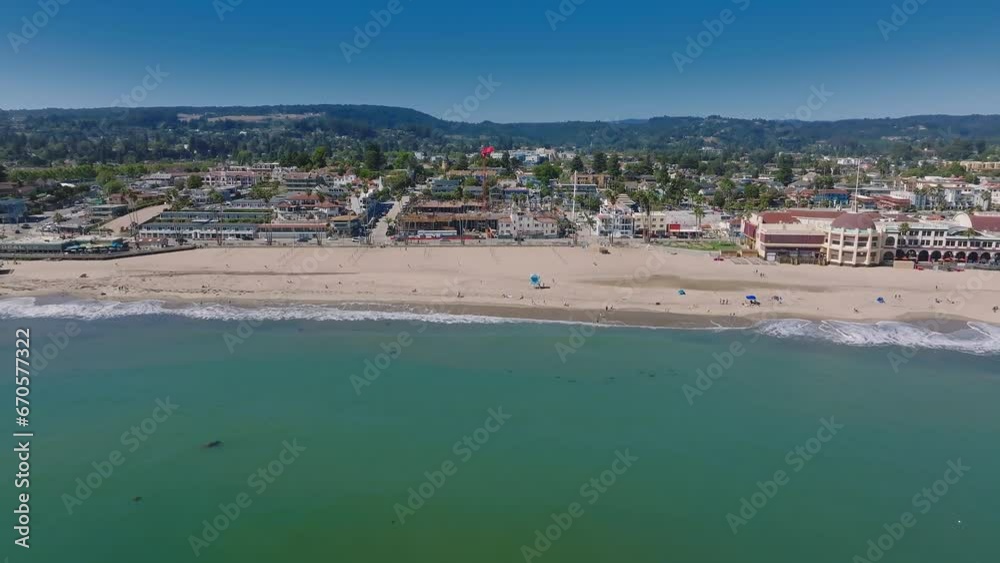 Aerial view of the Santa Cruz holiday town by the Pacific coast in the USA. Historic Santa Cruz Beach Boardwalk. The oldest outdoor amusement park in California. Aerial view of the Santa Cruz holiday town by the Pacific coast in the USA. Historic Santa Cruz Beach Boardwalk. The oldest outdoor amusement park in California.