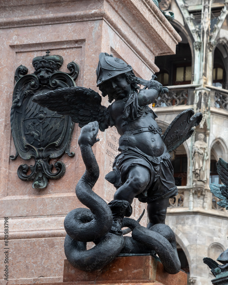 Putto created by Ferdinand Murmann at the corner of Mary's column in Marienplatz in Munich, Germany. It is depicted fighting a serpent representing heresy.