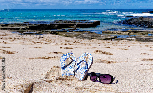 Flip flops and sunglass on Playa de los Ojos - Fuerteventura, Canary Islands, Spain