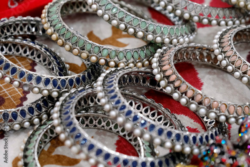 Indian bangles displayed in local shop in a market of Pune, India, These bangles are made of Gold, Silver and diamond as beauty accessories by Indian women.